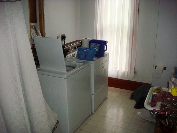 We set up our washer and dryer in our second floor bathroom. It's not perfect, but it'll do. 